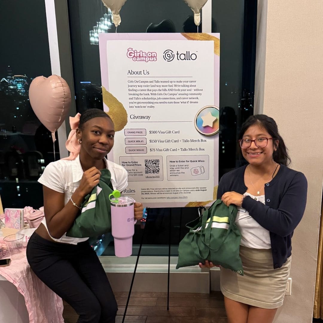 Two college students standing in front of Tallo and Girls on Campus Poster