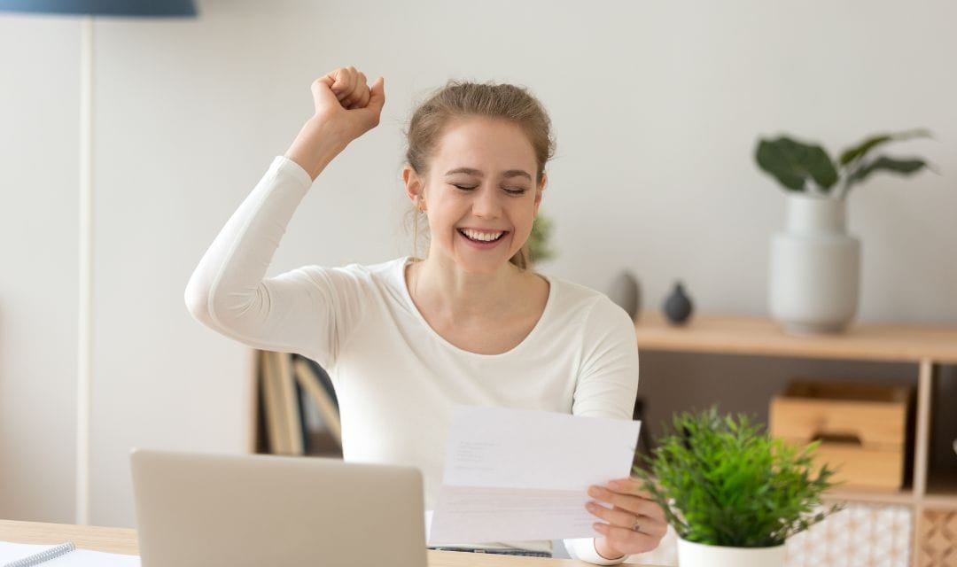 Young-woman-gets-great-news-and-celebrates
