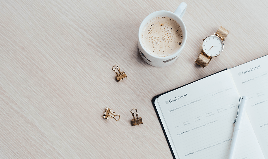 paperwork on a table with coffee