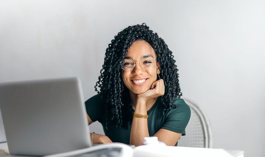 smiling student at computer