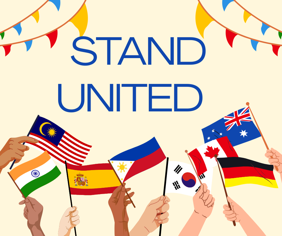 Bold blue text reading STAND UNITED centered on a light background with colorful bunting banners across the top and diverse hands holding international flags